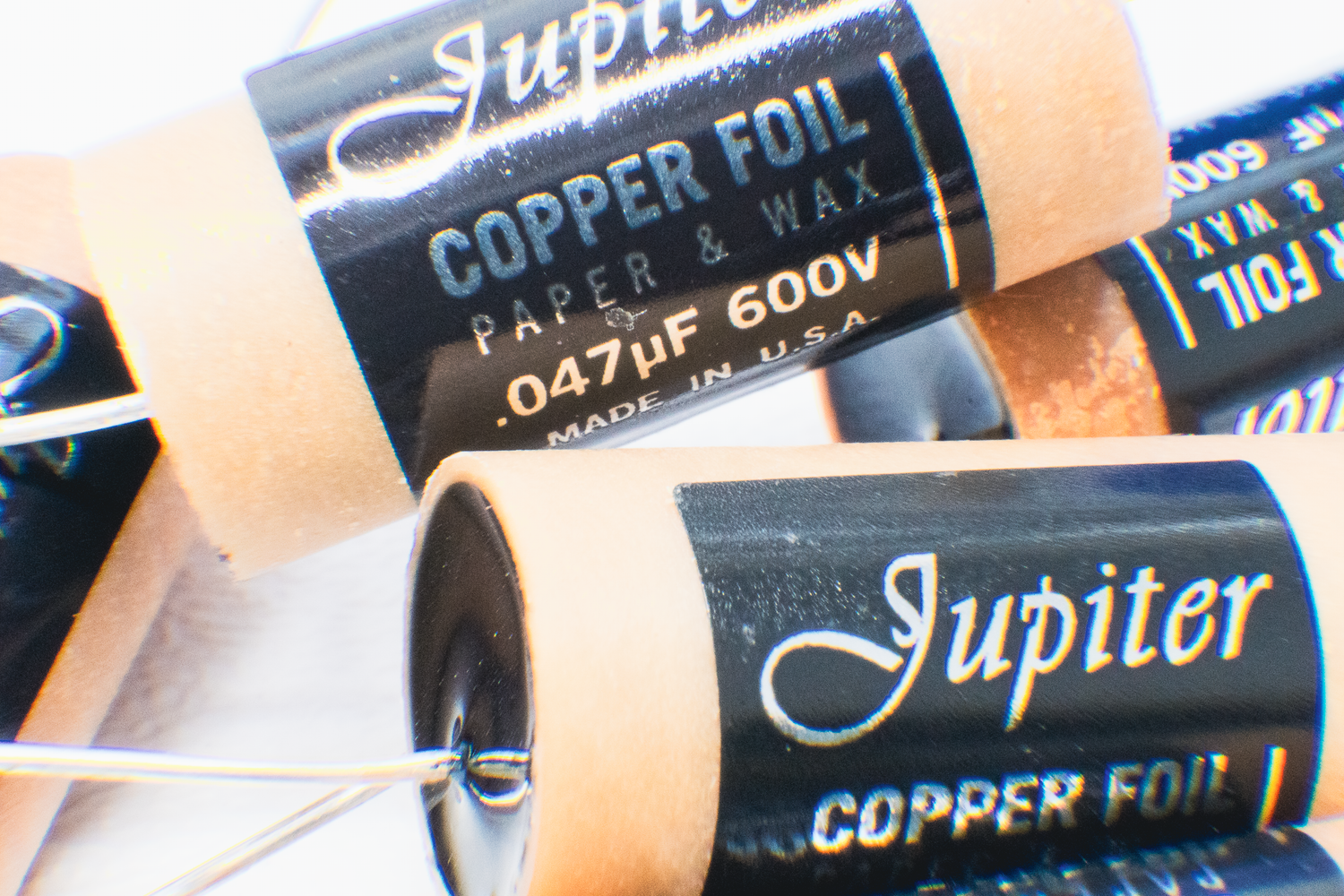 Copper foil paper and wax capacitors with 'Jupiter' branding.